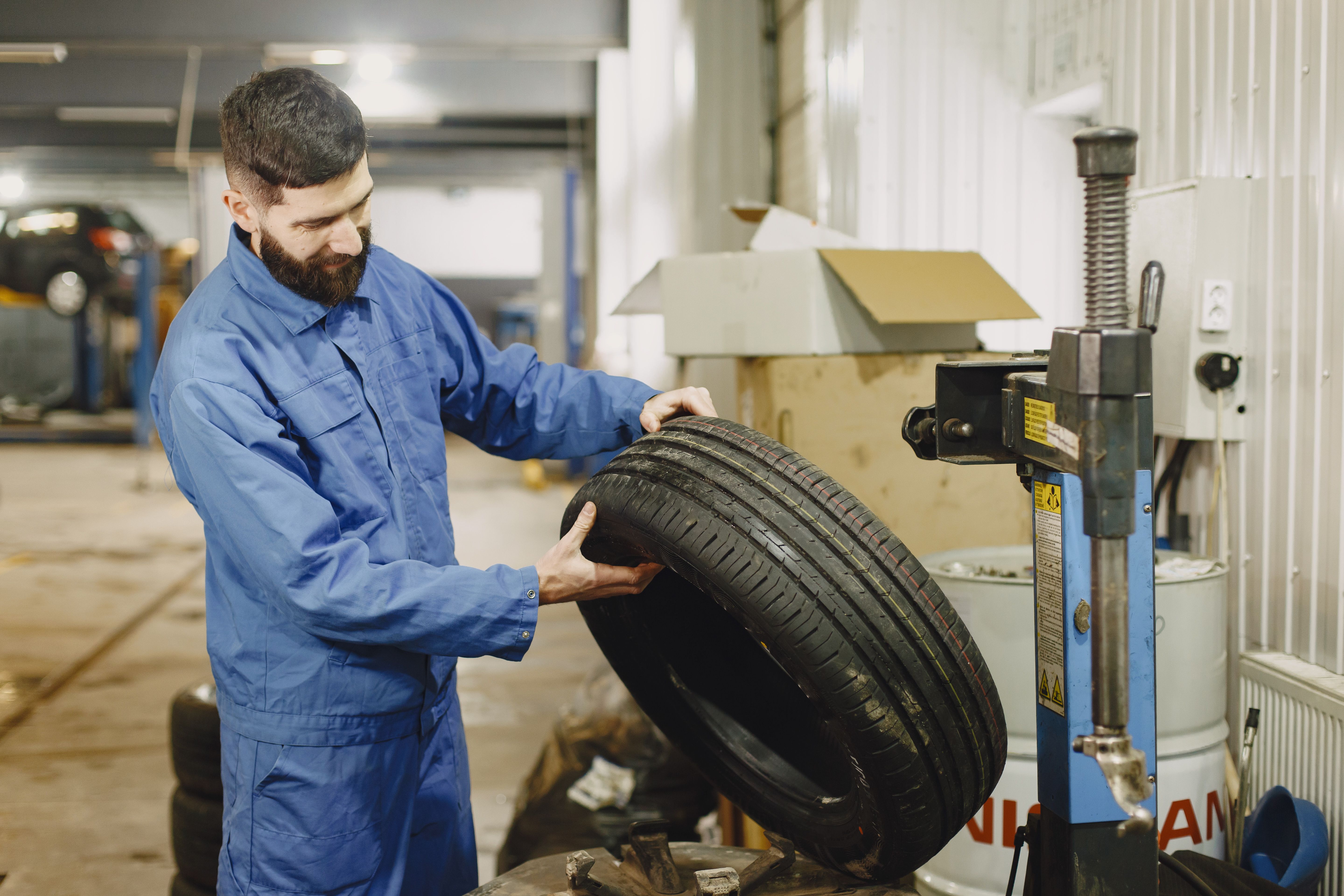 Professional tire service technician at work